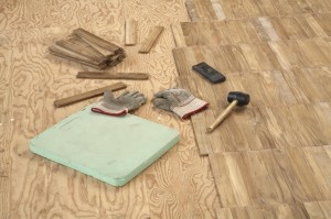 Laying wooden parquet flooring.